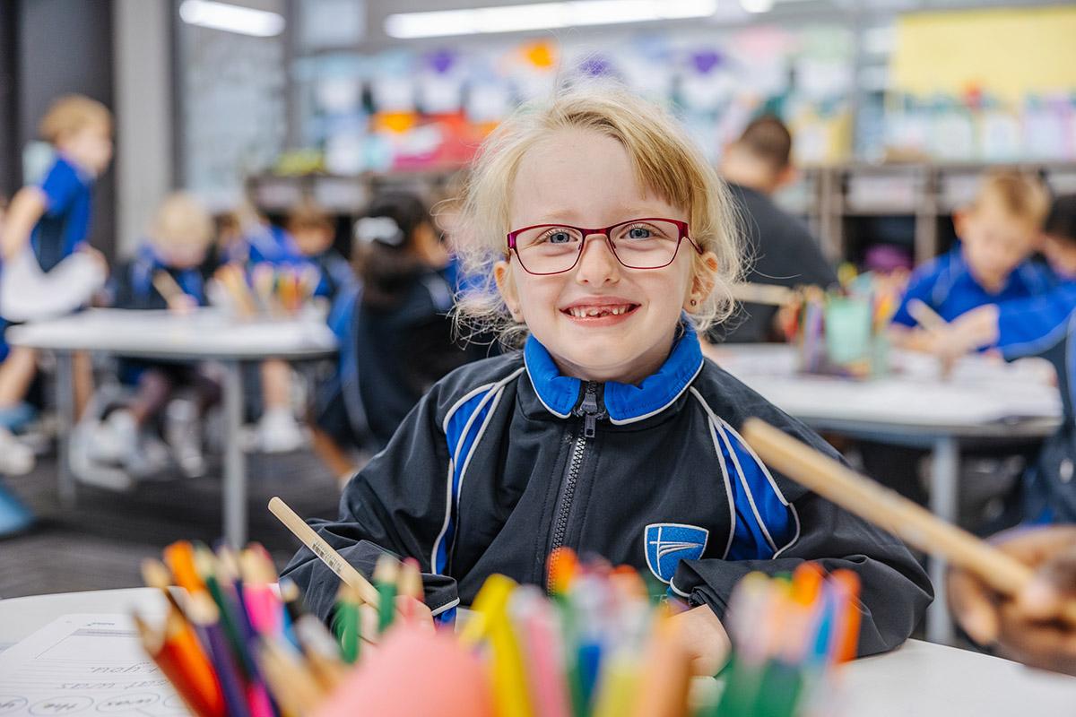 Prep student smiling during classroom learning at ACC Moreton.
