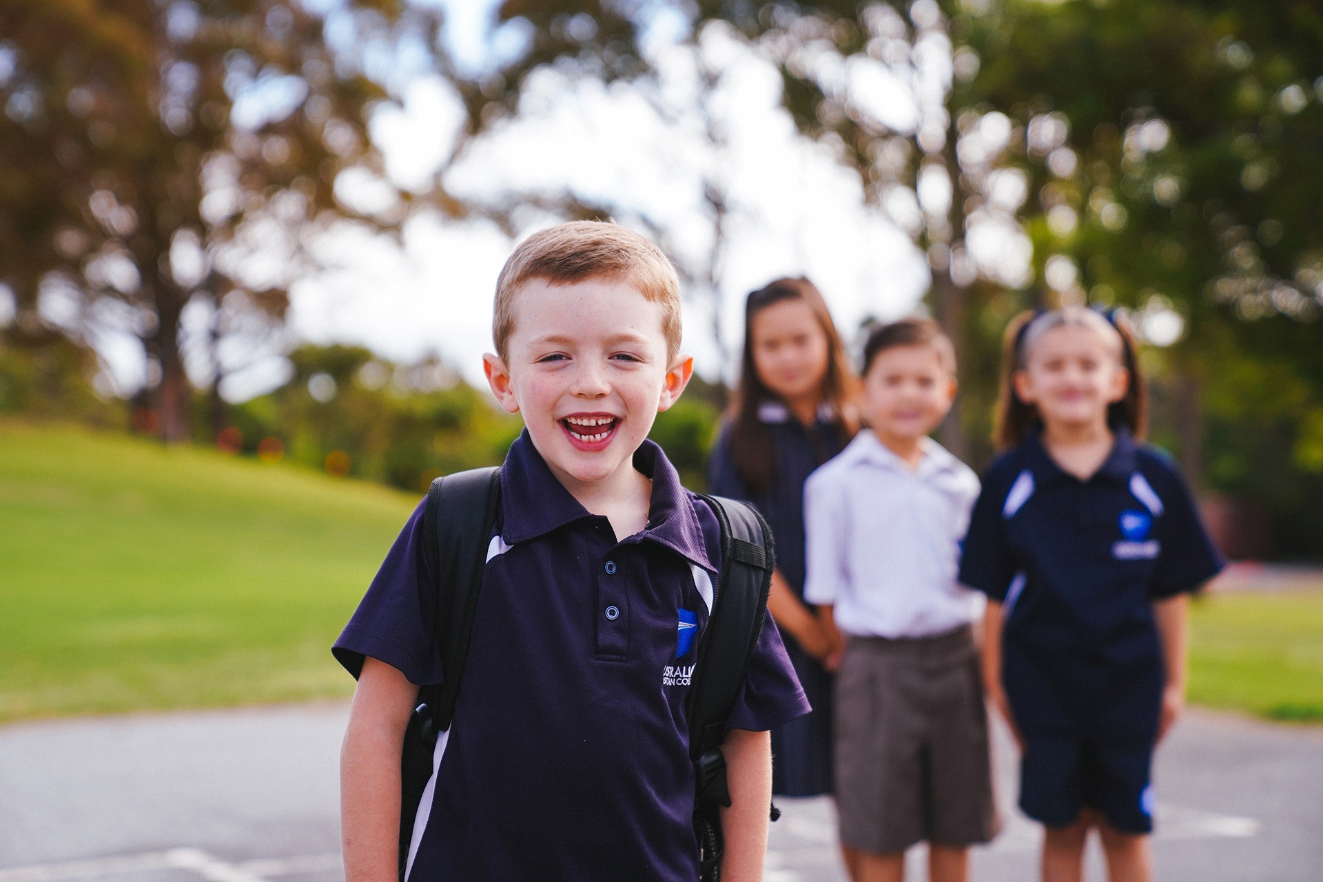 ACC Benalla primary boy wearing sports uniform and backpack on school oval