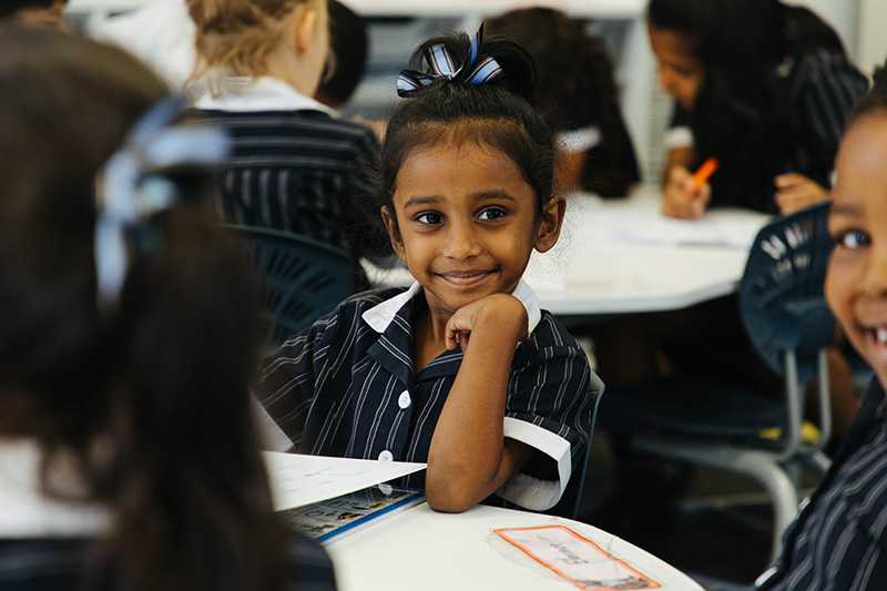 Smiling ACC Benalla primary school student sitting in class