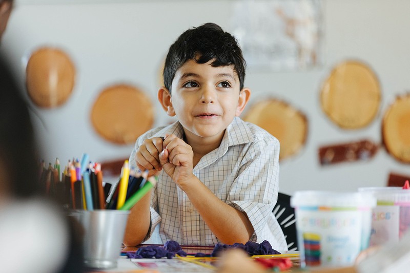 ACC Benalla primary boy sitting at desk with pencils in the foreground