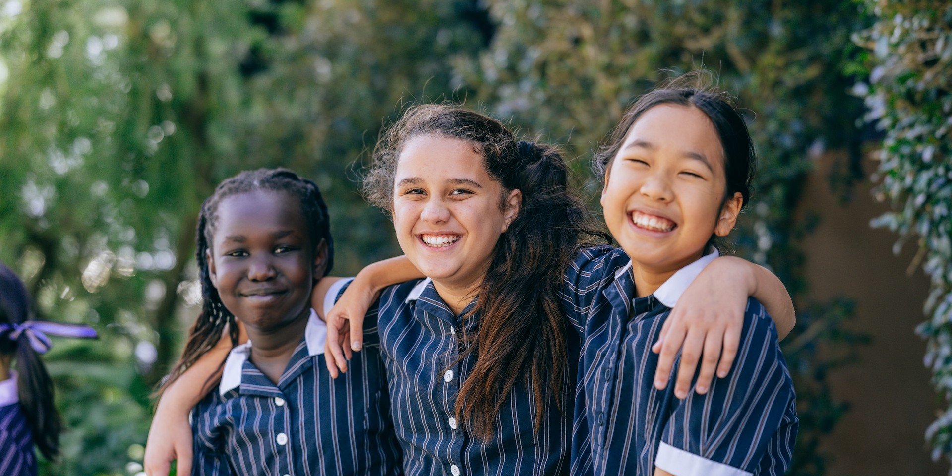 Smiling Somerset year 6 student wearing ACC Burnie school uniform blazer