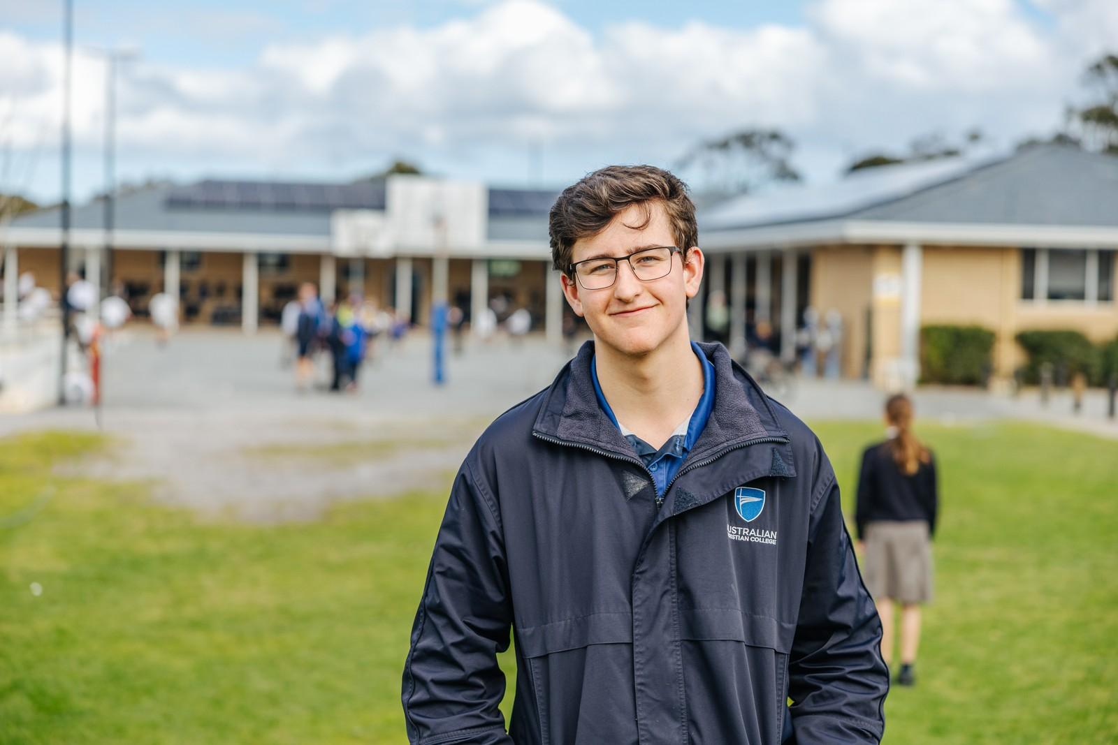 Secondary boy on school grounds at Australian Christian College Southlands